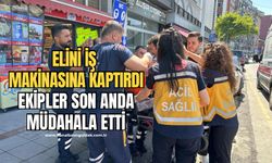 Tadilat yaparken elini iş makinasına kaptırdı