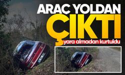 Yoldan çıkan araçtan yara almadan kurtuldu