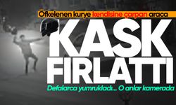 Öfkelenen kurye kendisine çarpan araca kask fırlattı