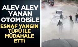Motor kısmından yanan otomobile yangın tüpü ile müdahale ettiler