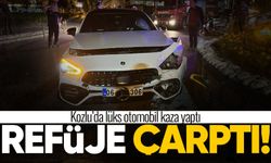 Kozlu'da kaza: Lüks otomobil refüje çarptı!