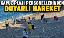 Kapuz Plajı'nda örnek mesai:Ekipler izmarit ve çöpleri tek tek topladı