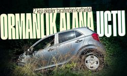 Otomobil ormanlık alana uçtu: 2 kişi kurtarıldı
