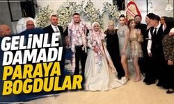 Gelinle damadı paraya boğdular