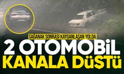 Sağanak sonrası kayganlaşan yolda 2 otomobil kanala düştü