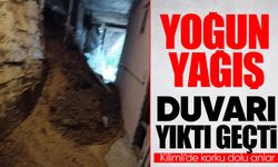 Kilimli’de yoğun yağışla birlikte duvar yıkıldı, toprak binayı doldurdu!