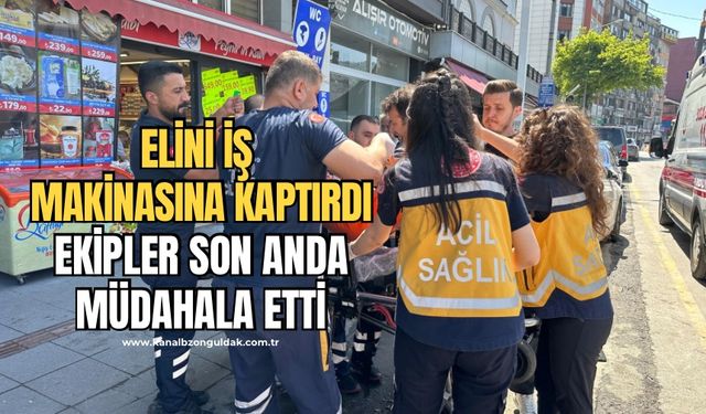 Tadilat yaparken elini iş makinasına kaptırdı