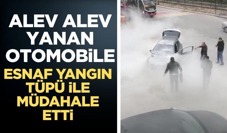 Motor kısmından yanan otomobile yangın tüpü ile müdahale ettiler